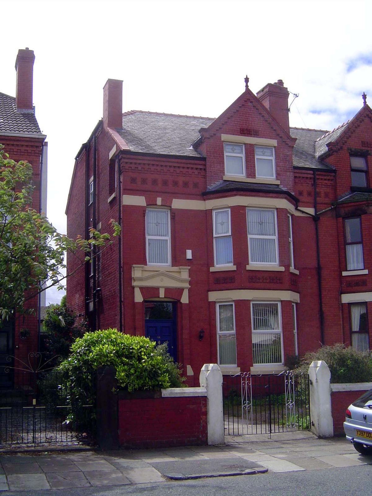 It's still terrace housing, but now there's a front yard and a third floor.