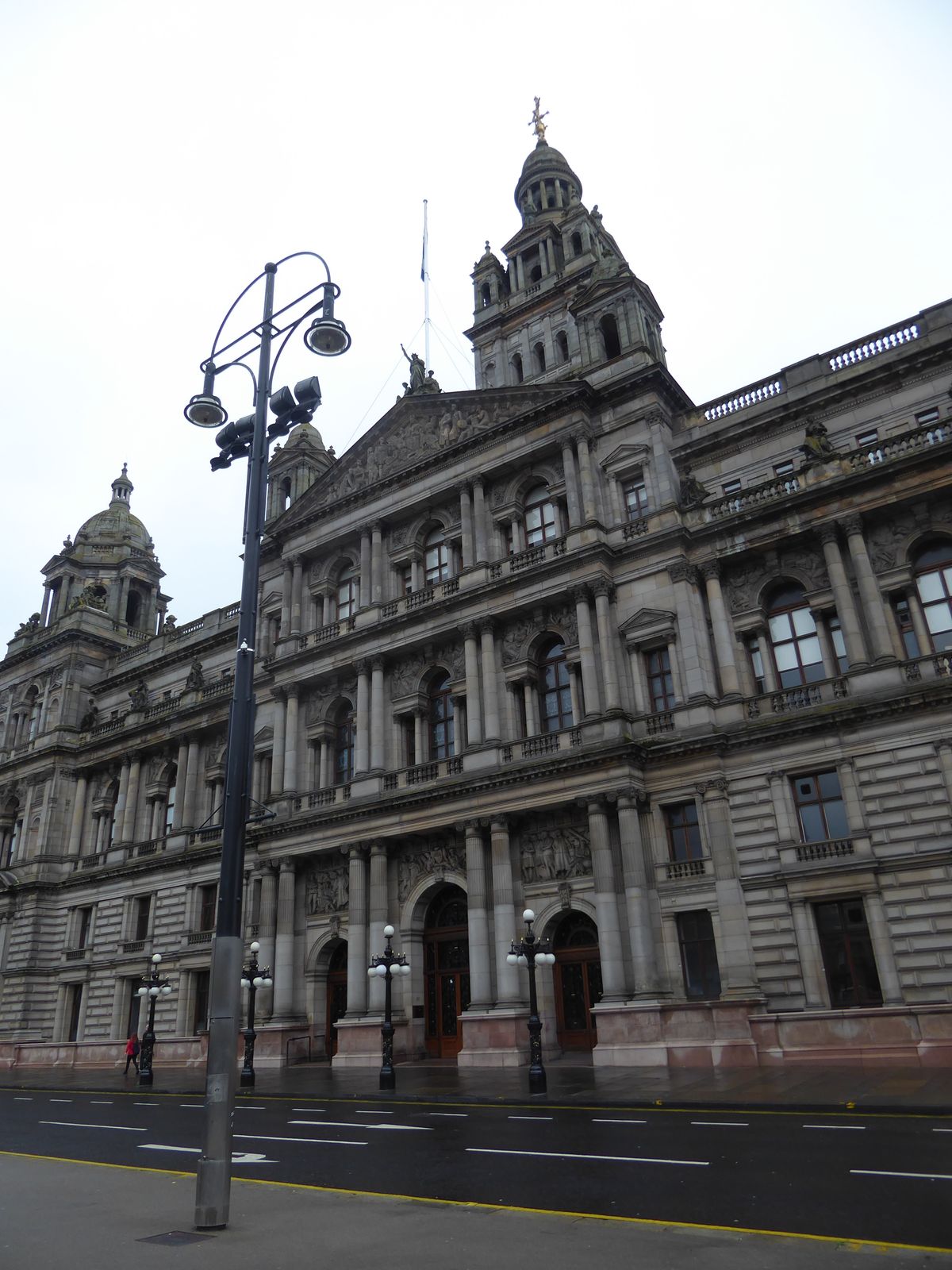 The architect of the City Chambers, William Young, described the design, executed between 1883 and 1890, as a "free and dignified treatment 