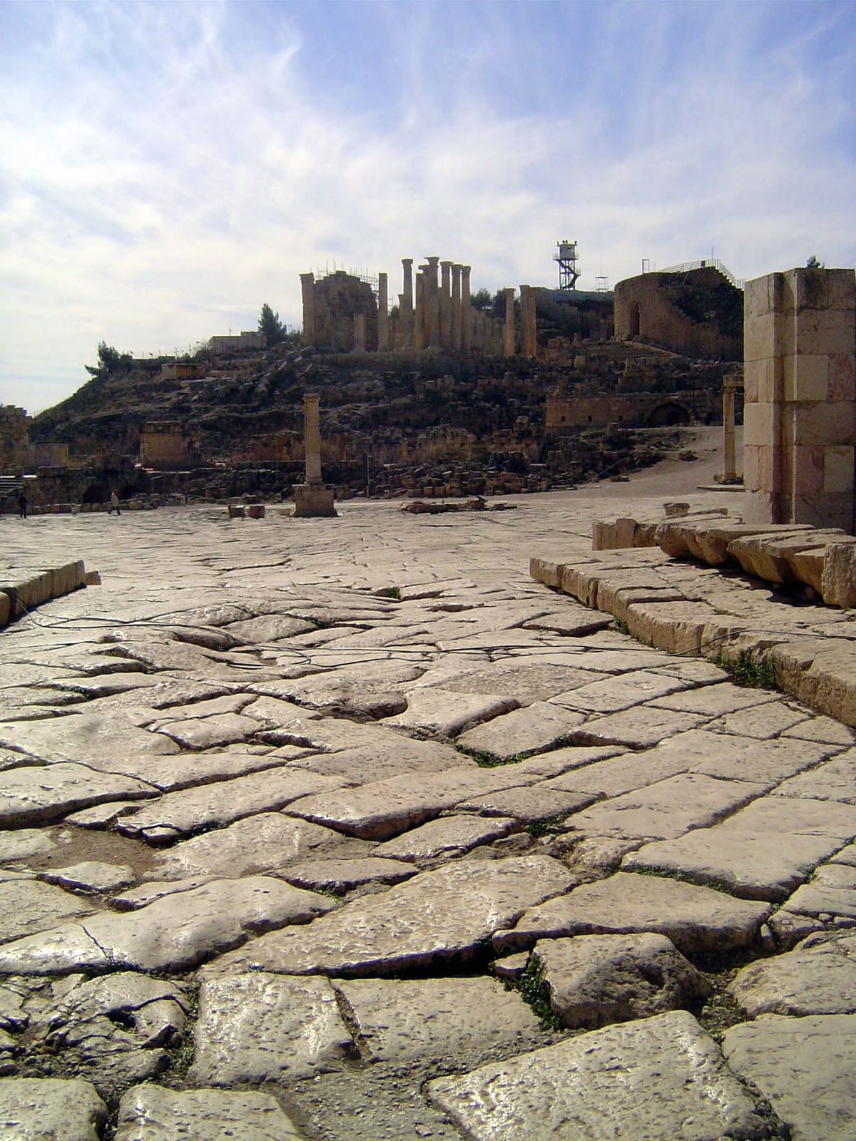 Looking south from the cardo over the oval and up to the Temple of Zeus and, on the right, the theater.