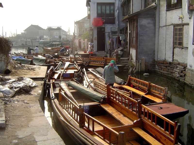 The tourist fleet is tied up at the edge of town.