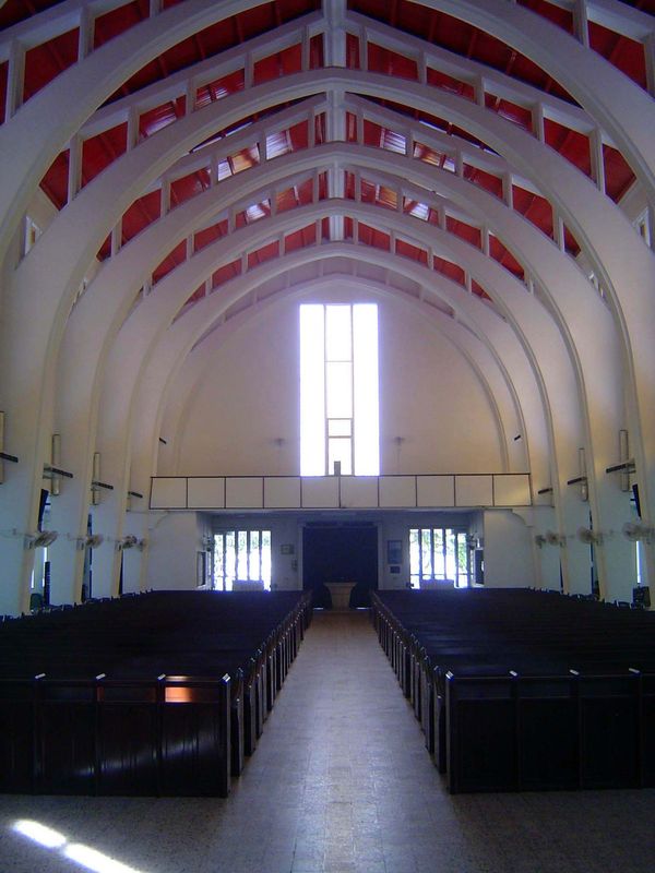 Interior of the new church. The original was built by a German carpenter and was a marvel in unpainted wood. Perfectly shaped columns suppor