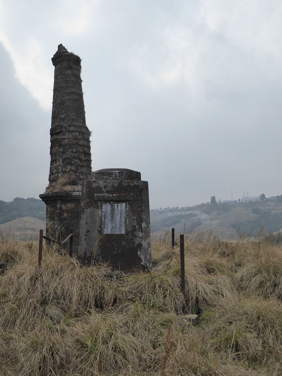 There are a few elaborate but still illegible monuments.