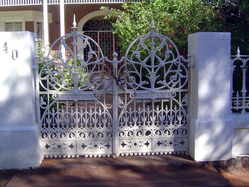 Its wrought-iron gate.