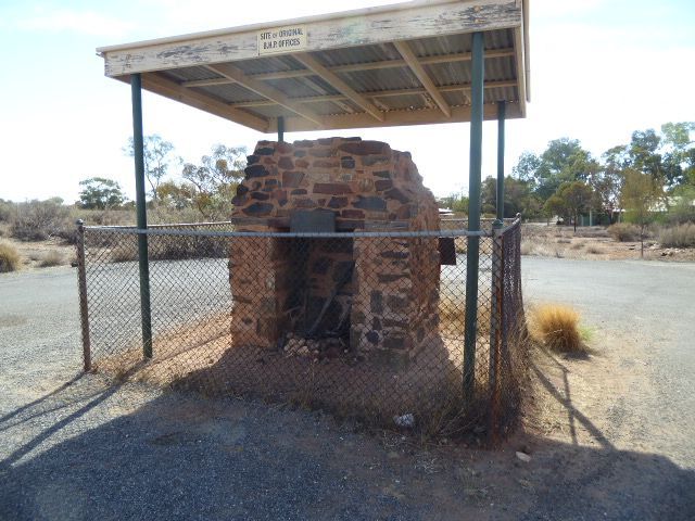Why fence an old fireplace? The sign tells the story.