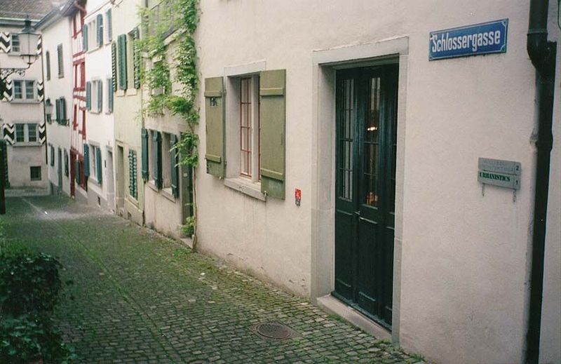 A nearby residential lane, scrubbed tight.