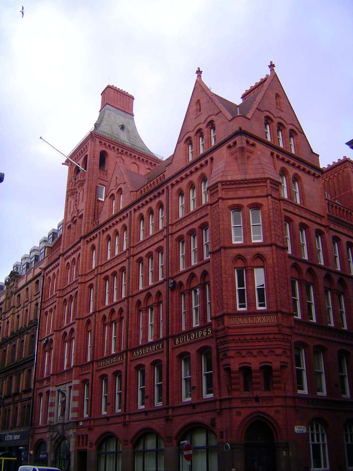 Farther down the street, Prudential Assurance, 1886, by Alfred Waterhouse, fresh from designing what Hughes calls the "Wagnerian Gothic" Man