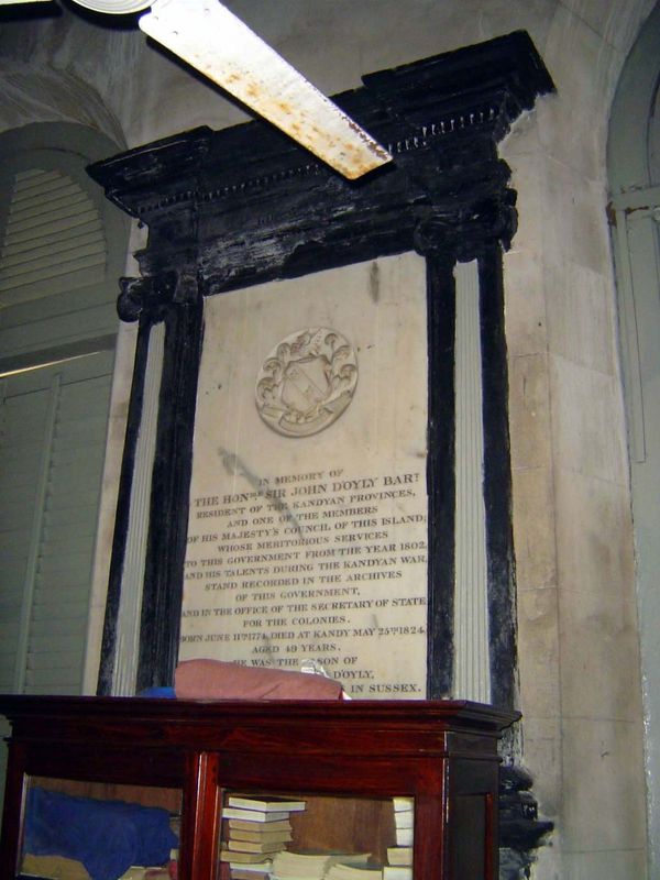 "In memory of the Hon. Sir John D'Oyly, Bart, Resident of the Kandyan Provinces, and one of the Members of H.M. Council of this Island, whos