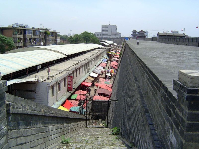 Land is too expensive for much land to remain open; here, a market is squeezed inside the southeast corner of the wall.
