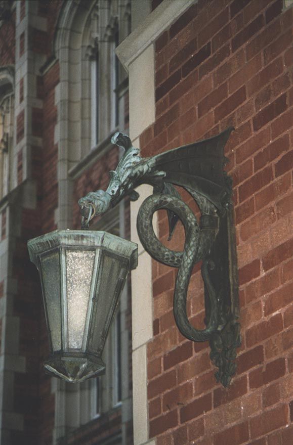 A light fixture framing the main entrance. The symbolism of winged dragons guarding the president's office is overlooked by the unwise.