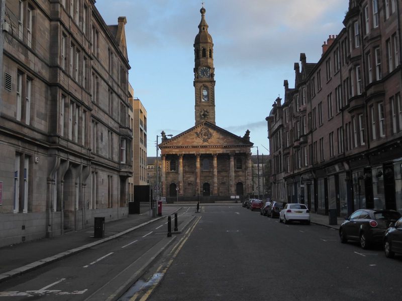 A hundred meters farther along High Street and we can peek down to St. Andrews Parish Church, completed in 1756 and seen here from the block