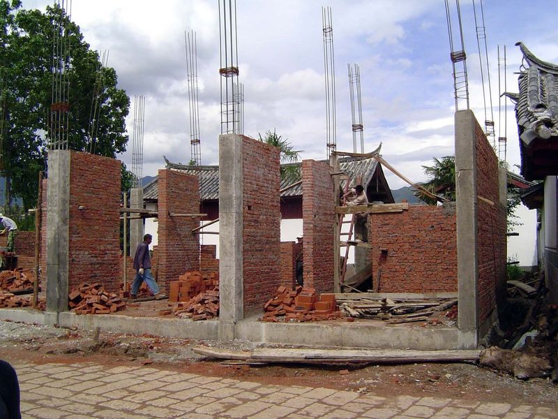 The options now include concrete and rebar, almost certainly cheaper than the traditional wood frame but less tolerant of earthquakes and le