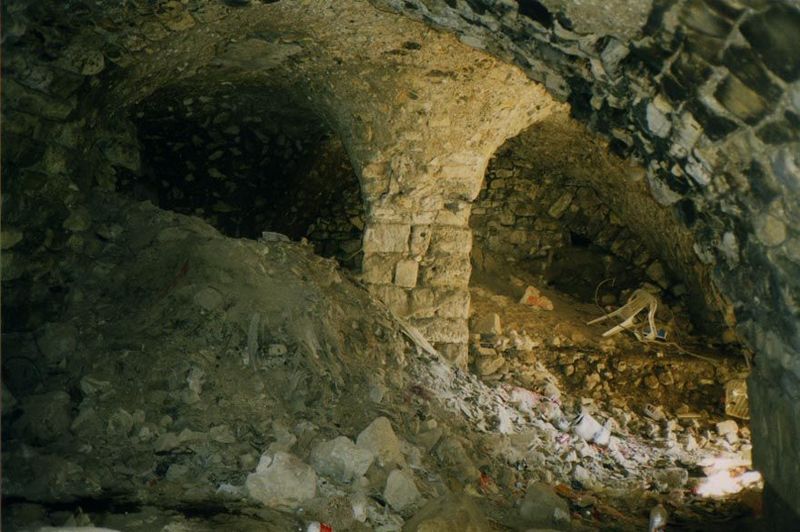 Down in the basement of the fortress, work goes on excavating the debris of centuries.