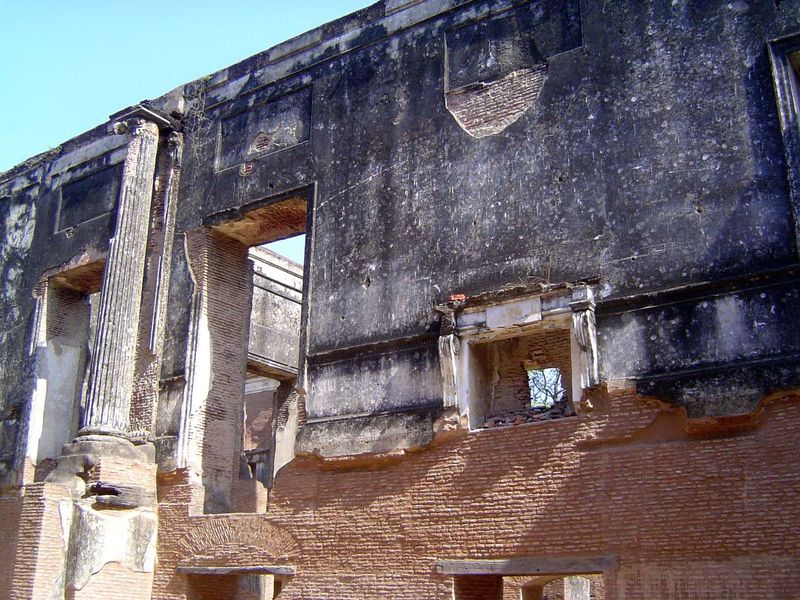 A stucco fireplace missing its floor.
