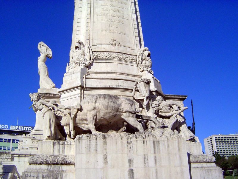 The base of the statue celebrates honest labor, or at least hard labor.