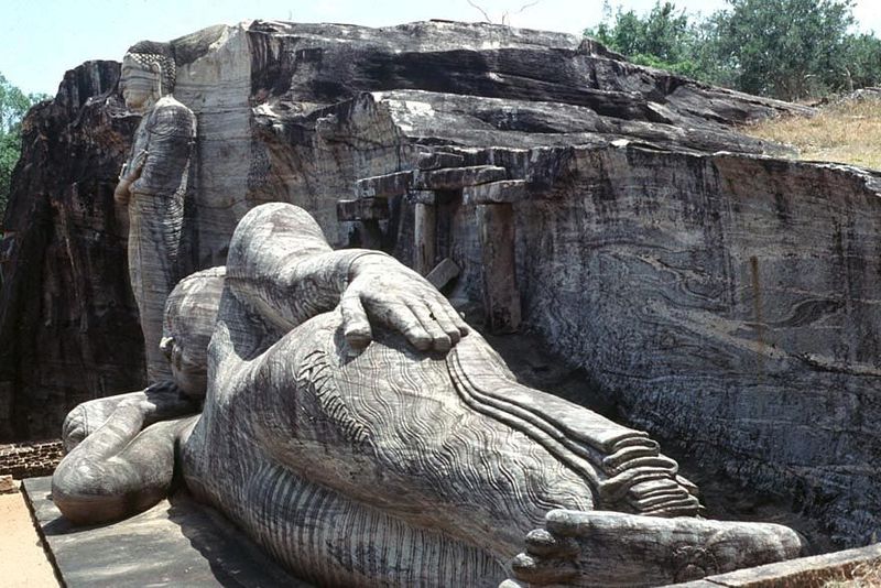 There are four figures here, one standing, two sitting, and one—the largest, at about 45 feet—appearing to sleep.
