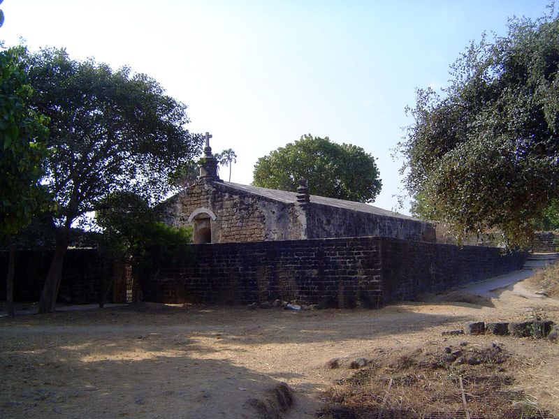 The cross suggests that this was a church, although the lack of windows suggests otherwise. It was, in fact, a powder magazine, and its wall