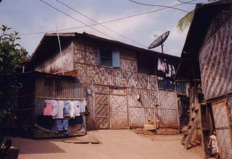 Signs of modernization are everywhere, including not only store-bought clothing but satellite dishes.