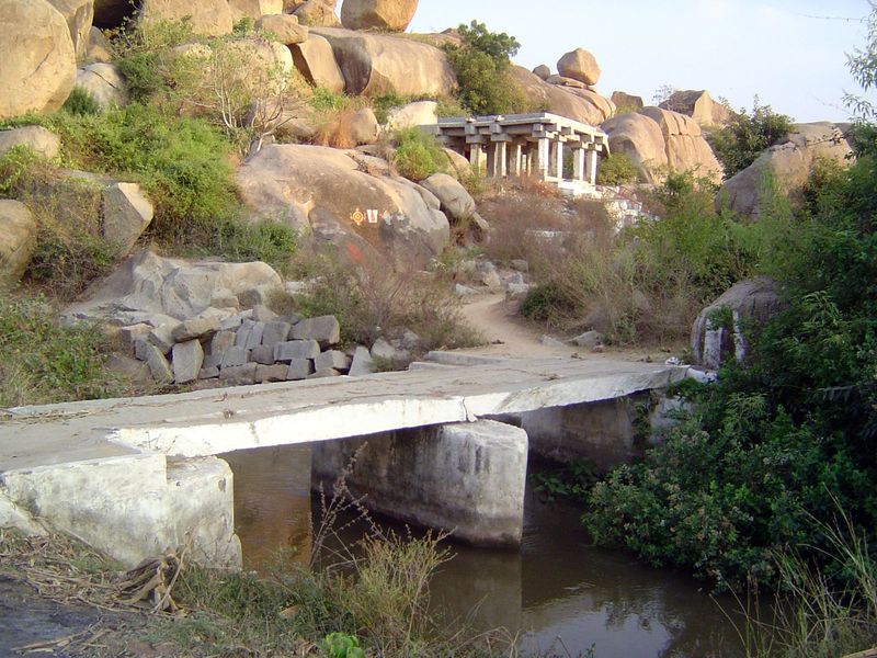A new bridge leads to an old temple.