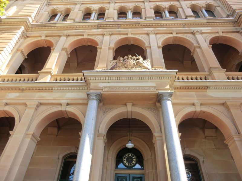 The sign reads Colonial Secretary; the building is now called the Chief Secretary's Building. The architect was the same James Barnet who di