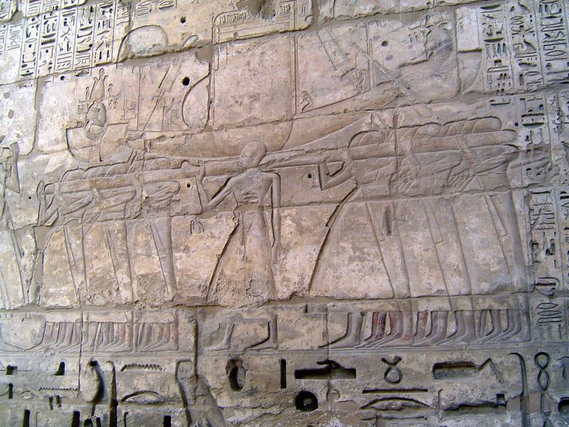 It's not all gore. Here, priests carry the sacred bark of Amun.