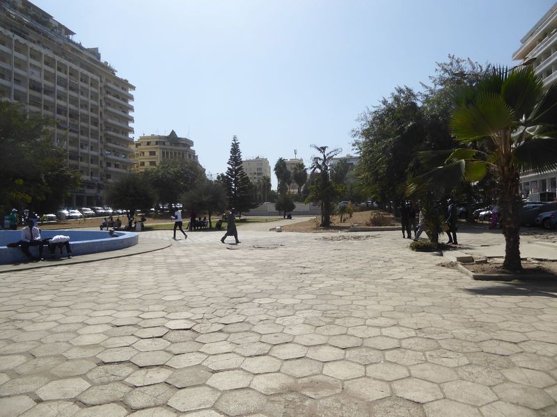 Hardly a ten-minute walk from the harbor, we've made it to the monumental center of Dakar Proper and the focal point of the master plan of 1