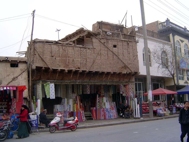 Simple construction with wood frame and mud-brick infill.