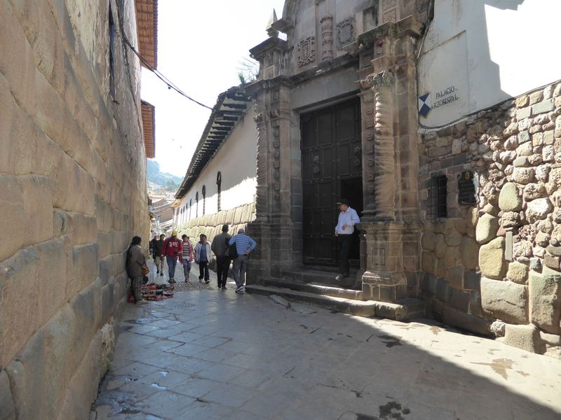 Here it is in 2018, repaved and with most of the overhead wiring relocated. The street is called Hatun Rumiyoc, Quechua for "great rock."