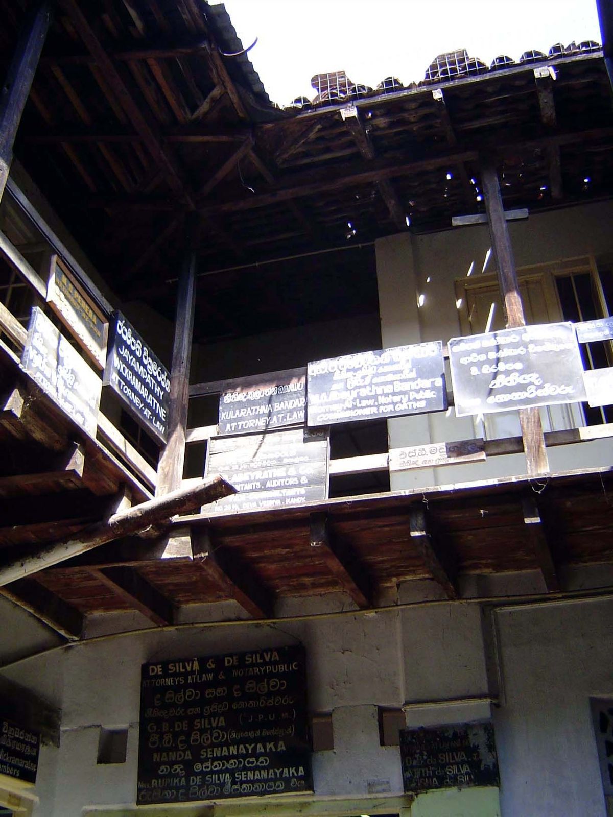 Enter the building and there are courtyards plastered with more shingles.