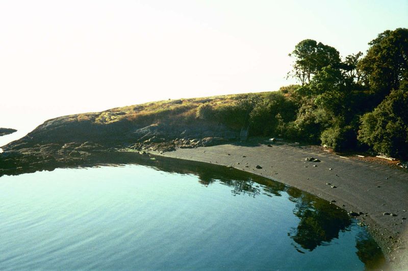The beach and the headland beyond was set aside as a park once the land behind it was carved into tiny lots.