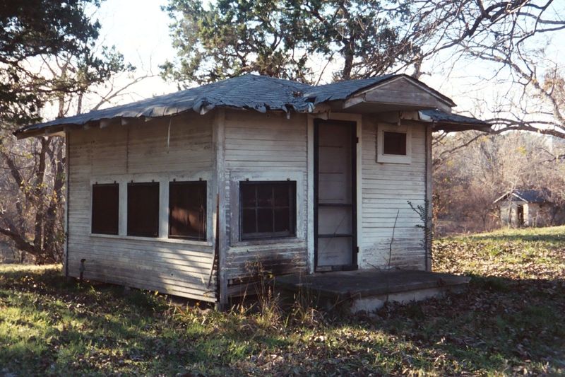 Last rented in the 1950s? The Paluxy is just behind the cabin, where the ground slopes away.