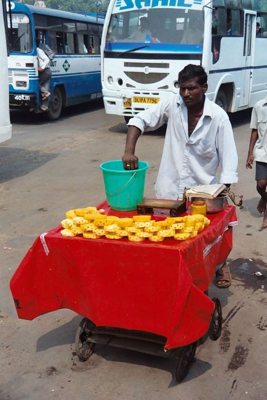 A fruit-vendor, ice-water at the ready. The open space between the Red Fort and Jami Masjid didn't just happen, although visitors are unlike
