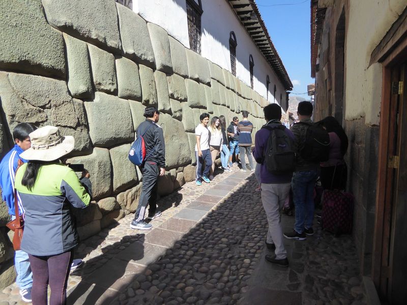 Hundreds of people pose daily with that great rock. We're looking, in Adam Herring's reading, at the northwest face of the wall around the s
