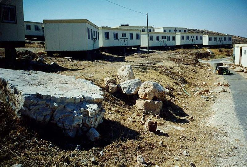 Most settlements begin like this, with rows of mobile homes. Years later, permanent housing may be built.