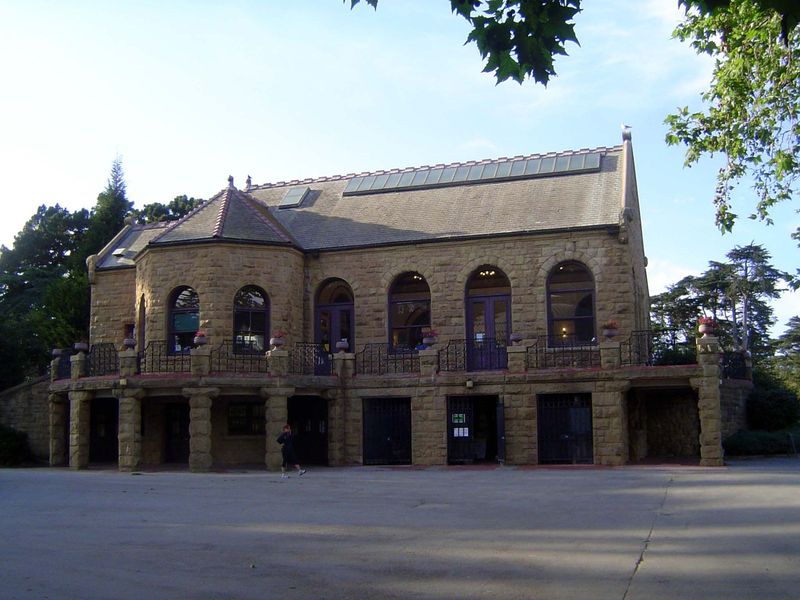 This strange building flanks the childrens' playground, where the boy went a hundred time.  The building was never, never open, but now it's