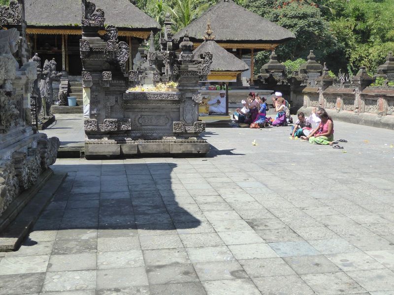 Both Mr. D and Sukarno are forgotten as offerings are made at the temple's pelinggah or gate shrine.