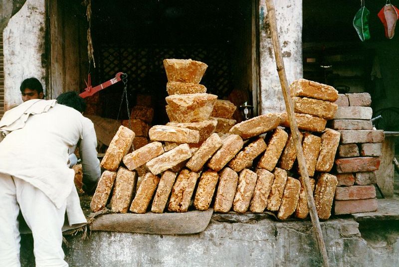 Blocks of crude brown sugar gur or jaggery, sold by weight. Better than chocolate.