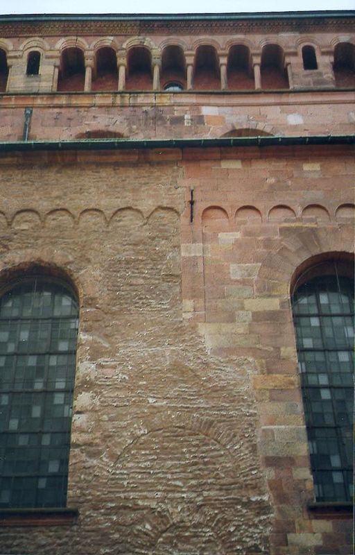 The church was built of red sandstone, apparently floated from the hills to the west. The rubble part of this north wall is from the 11th ce