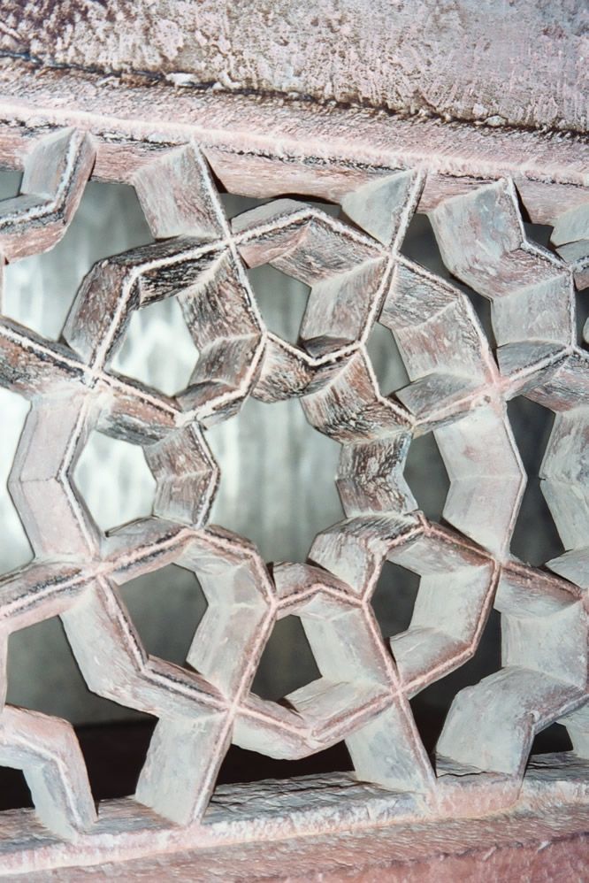 Bright sun is excluded from the tomb by windows screened by jalis, carved-stone lattices.