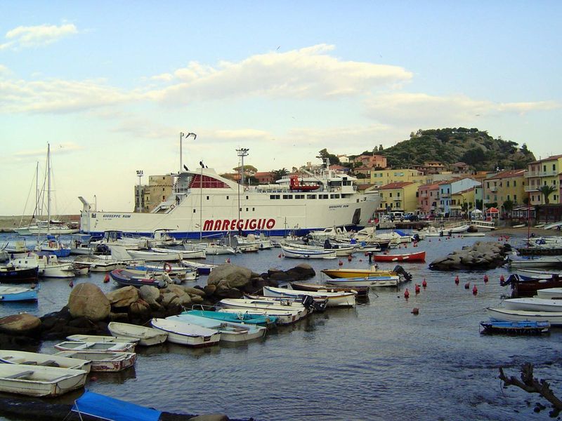 The Torre Saraceno peeks from behind the ferry. Built in 1596, the tower was part of the island's defenses against pirates.