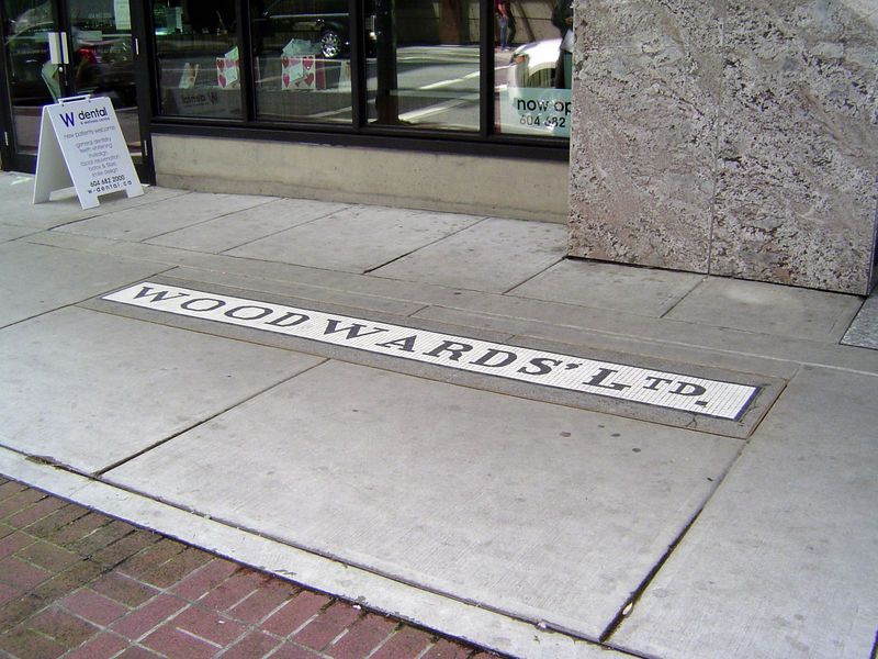 Set in the sidewalk is one hint. Woodward's was the leading department store in British Columbia for decades.
