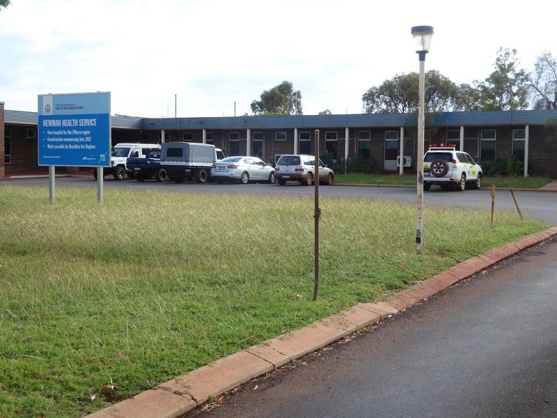 The sign announces that a new hospital is to be begun late in 2017.