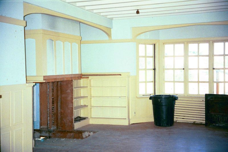 The living room, looking over the water. The fireplace masonry had all been removed because the house was moving.
