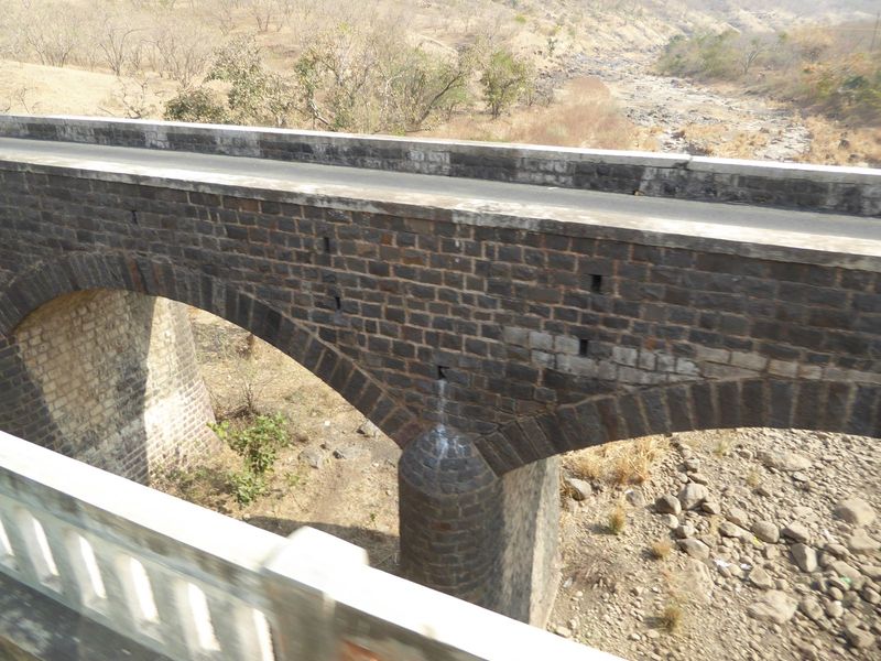 Here's the bridge that put Ajanta tourism on the map. It's dated 1938 and is used now only by the site's shuttle buses. We're on a second br