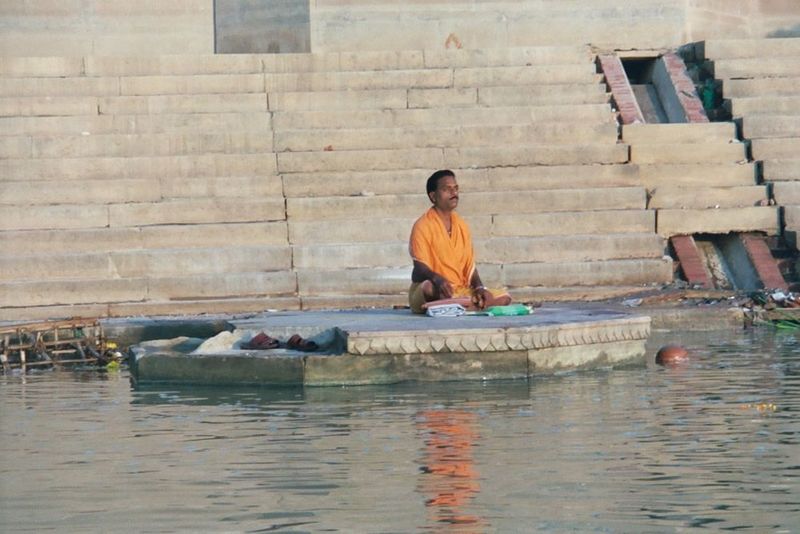 Morning prayers at one of the many ghats or steps that line the river's edge. The flotsam is disgusting to a few, trivial to the many.