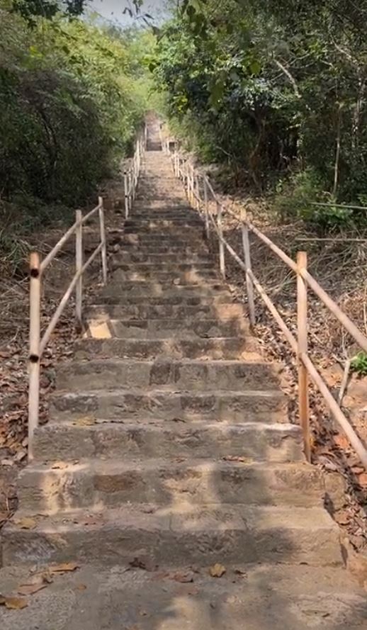 We've driven north from Vijayawada to Eluru or Ellore, then on secondary roads to Guntupalli, where stairs lead to caves near the top of a r