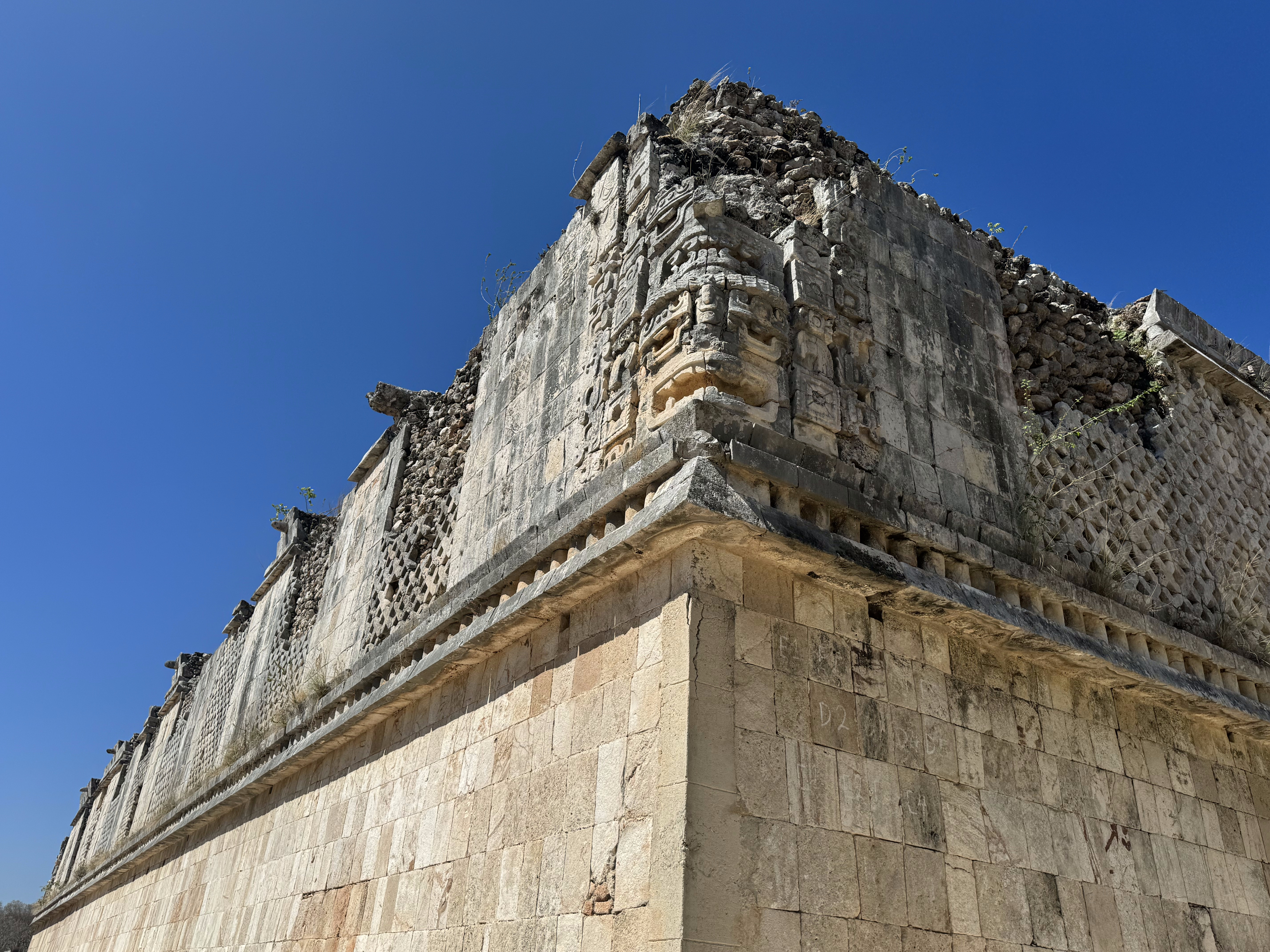 Stephens observed that the decoration of these buildings was a mosaic made of blocks, not thumbnail-sized bits.  What the mosaics meant, how