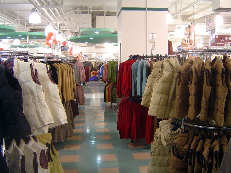 Racks of rags in an upstairs department store.