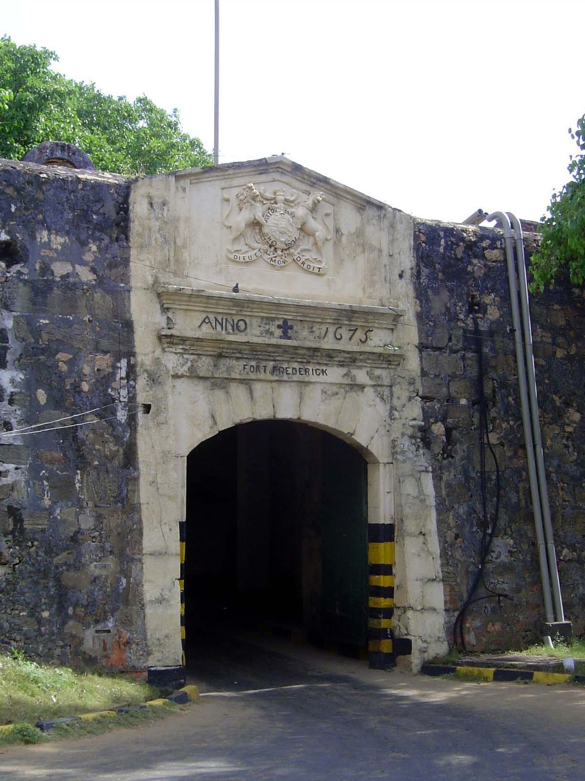 The road from the spit to the rocky hill leads to this old tunnel, piercing the wall into the old British naval base.