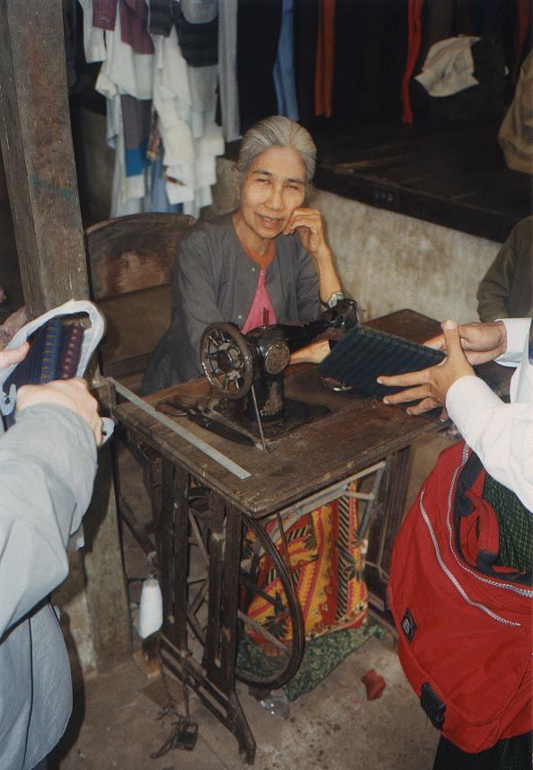 A seamstress in the central market. Blind in one eye, she did good work with the other.