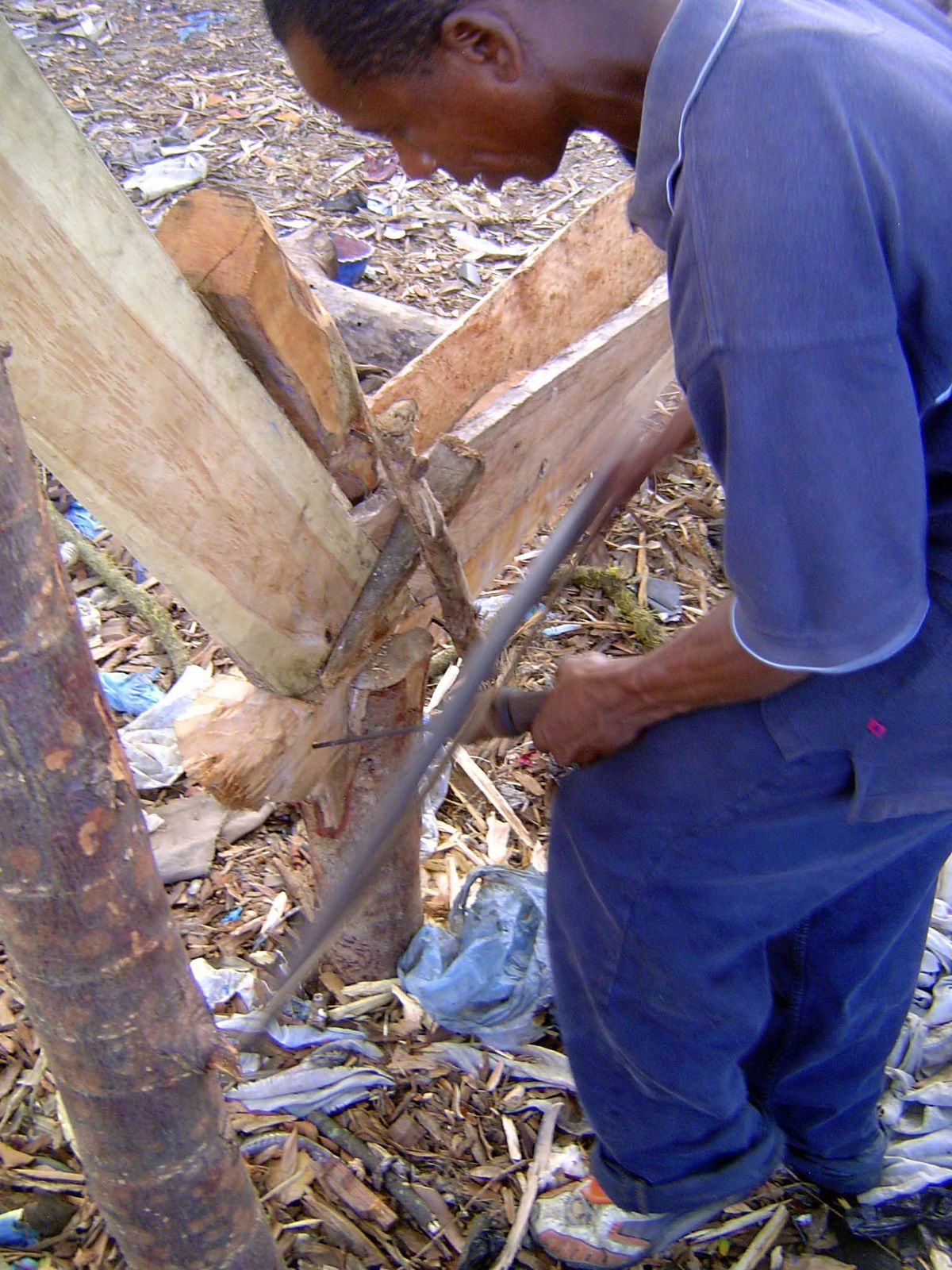 A drill bit is driven by a string attached to a bow, vigorously drawn back and forth.
